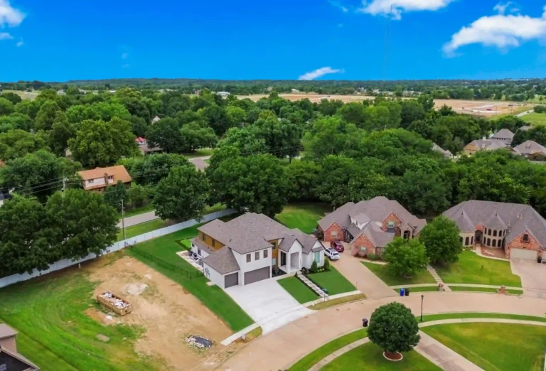 drone shot of newly remodeled home with new construction happening next door